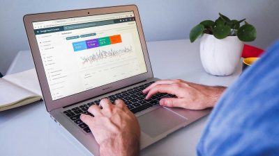 Person viewing Google Search Console on a Macbook Air laptop