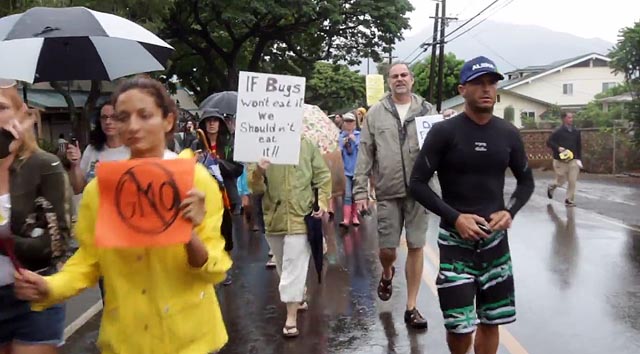 Big-wave surfer Shane Dorian marches against GMOs. Screen shot from 'Pro Surfers against GMOs'.