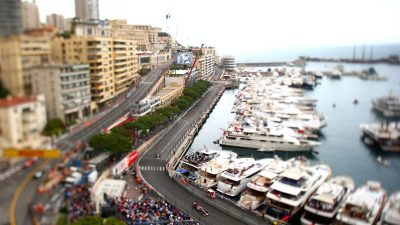 A crowd of people watching the Monaco Grand Prix race.