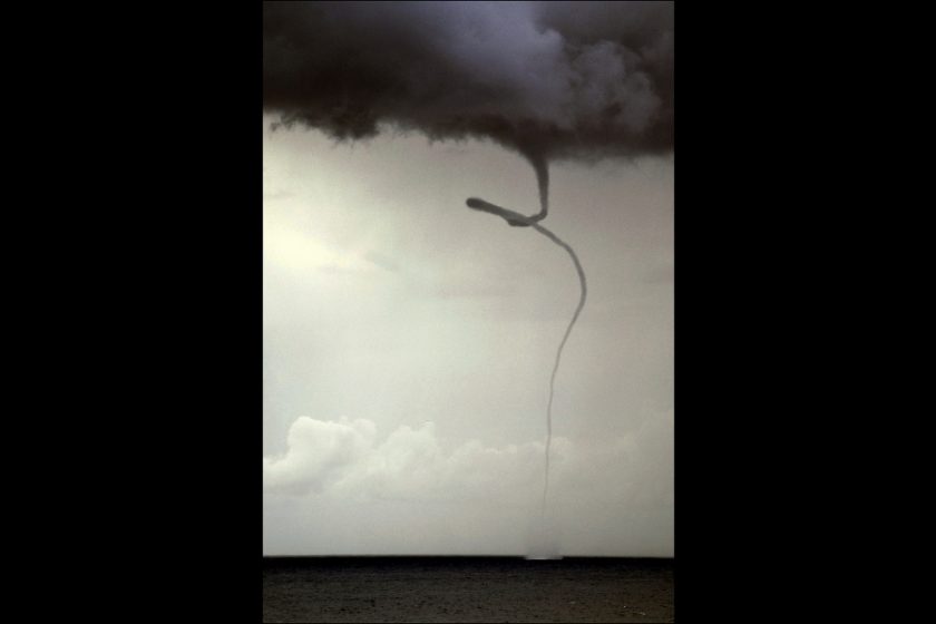 Waterspouts are tornadoes that only touch down on the water. While they are still super dangerous and should not be approached in a boat, they are much safer than tornados on land because of the lack of debris. Photo via Matador Network.