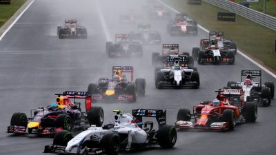 A group of racing cars on a wet track during the Hungarian GP.