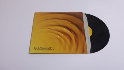 A Sunflower Yellow LP on a white surface.
