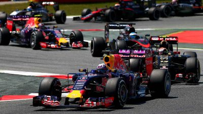 Race Report: A group of red bull racing cars on the Spanish GP track.