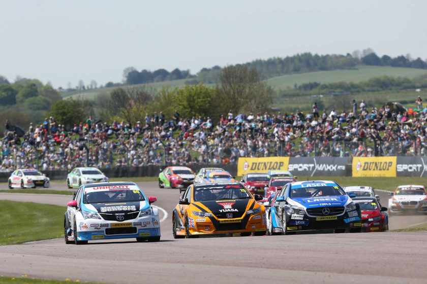 The action started three wide in front of a huge crowd. Photo: BTCC