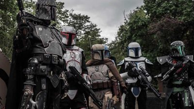 Group of people dressed in Star Wars Mandalorian cosplay constumes