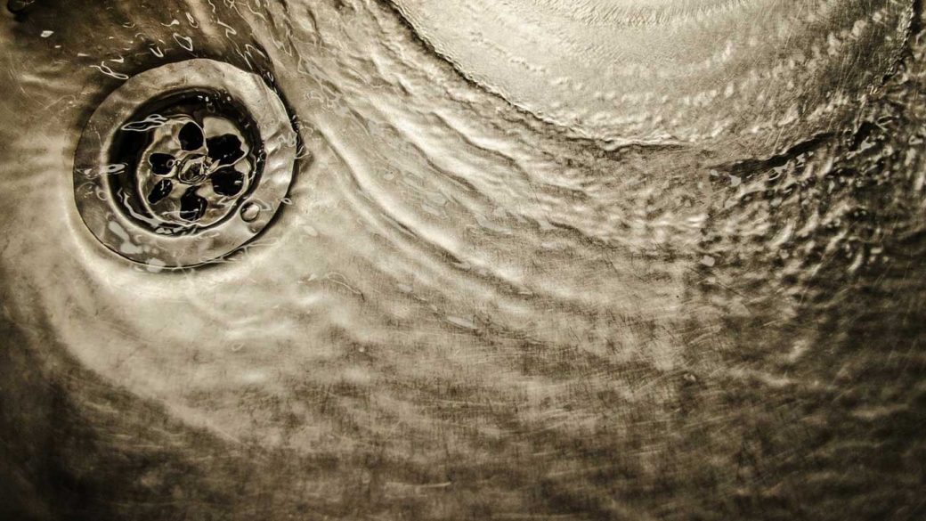 Water running down a sink drain