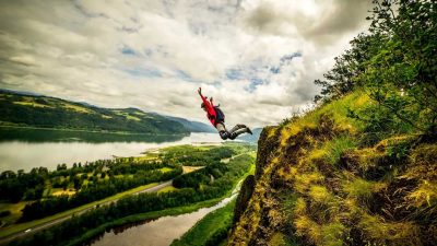 Clair Marie base jumping off a cliff