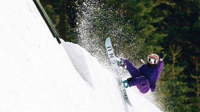 Jamie Anderson snowboarding on a halfpipe