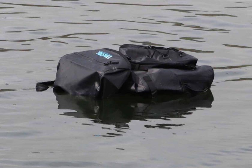DryTide 50L waterproof backpack floating on the ocean surface