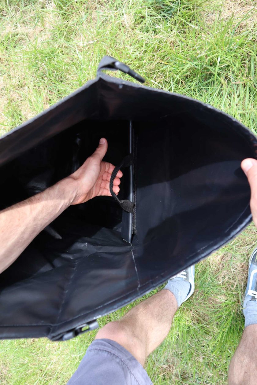 The internal laptop sleeve attaches to the main body of the bag using a vecro strip