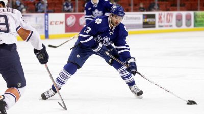 Nazem Kadri playing ice hockey for the Toronto Maple Leafs