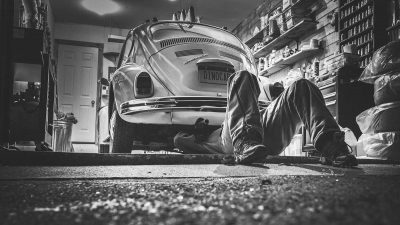 Car mechanic repairing a Volkswagen Beetle