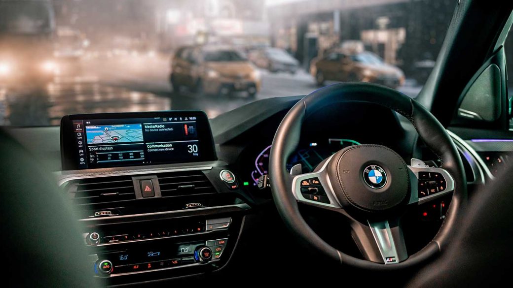 In-car view of a BMW car with double DIN display and audio units