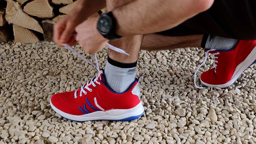 Tying the laces of the Relance running shoe to ensure a secure fit