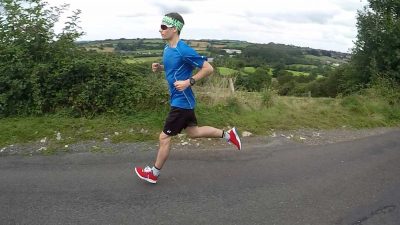 Running on the road with the Relance RL-01 running shoe in red