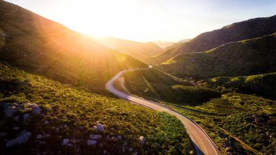 Winding road extending into the sunset