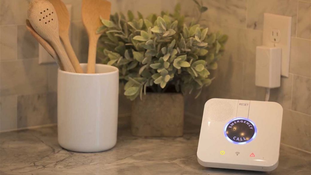 A medical alert system positioned on a kitchen countertop