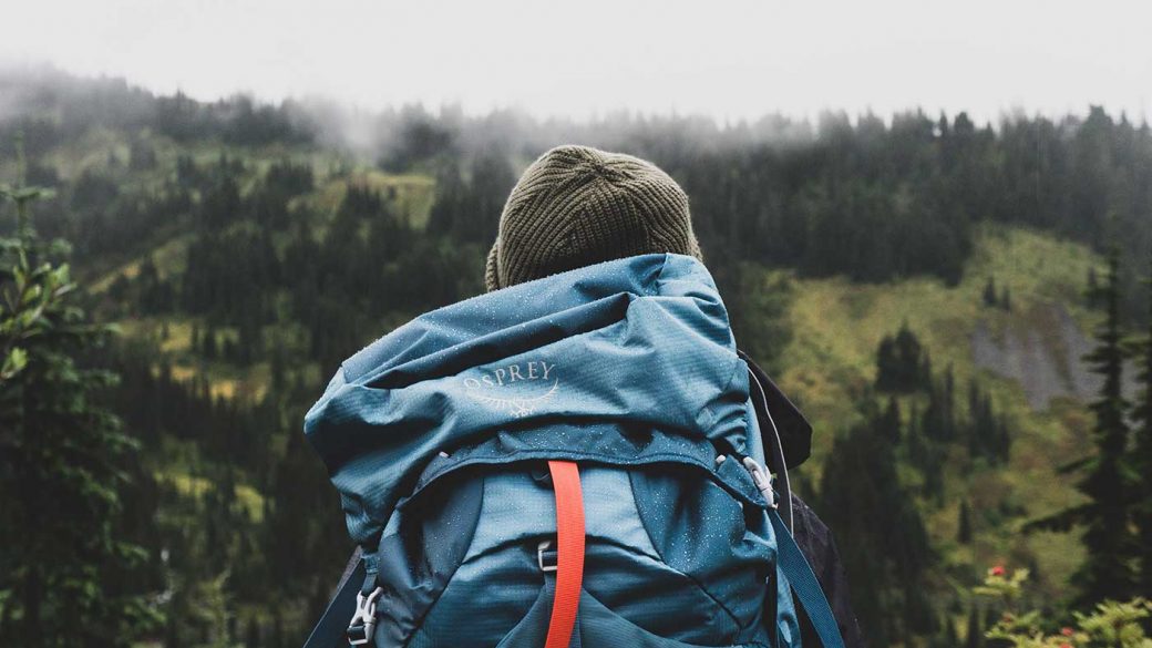 Backpacker visting a mountain forest