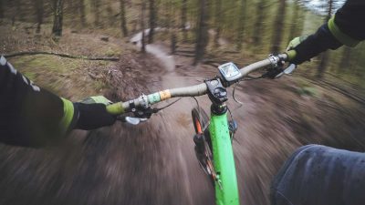 Mountain biker using a GPS tracker to guide them on the trail