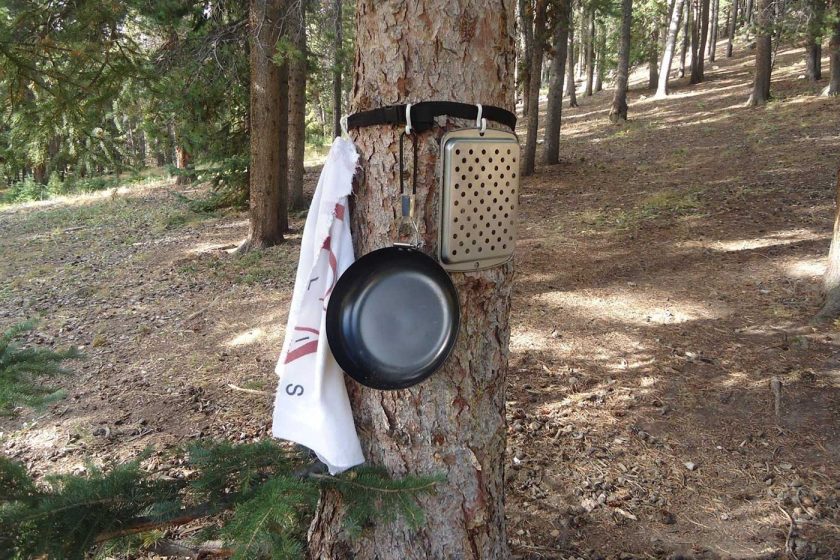 Camping hack 9: Create a makeshift pot rack with a belt and hooks