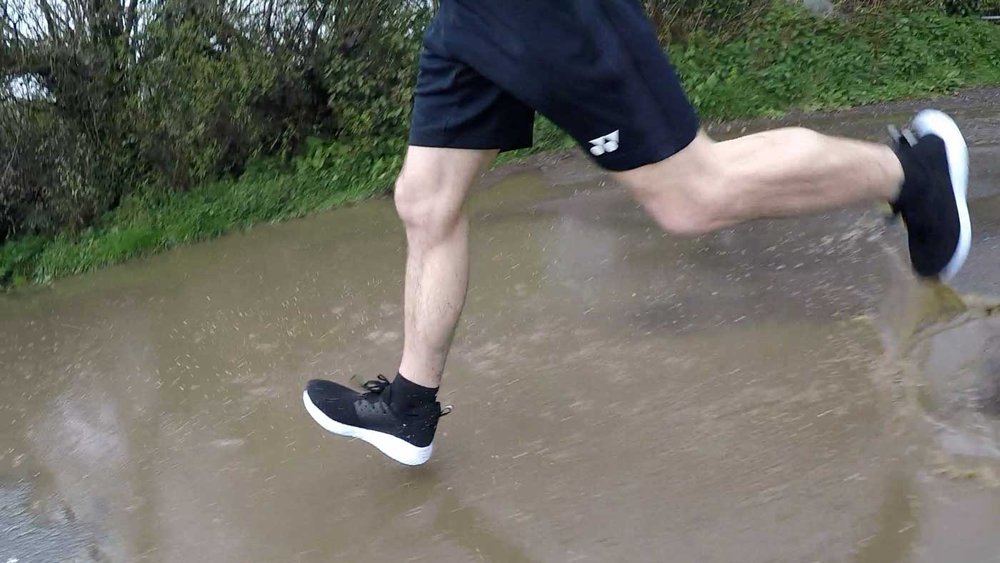 Running through a deep puddle with the Loom footwear waterproof sneakers