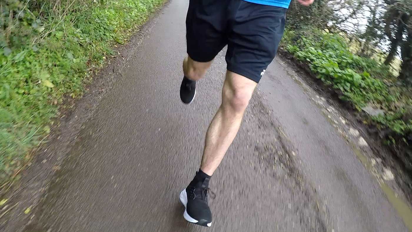 Front view of the Loom Footwear waterproof sneakers while running in the rain