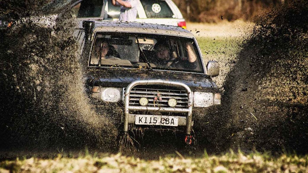 4x4 driving through a muddy ditch