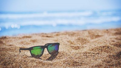 Sunglasses on a sandy beach