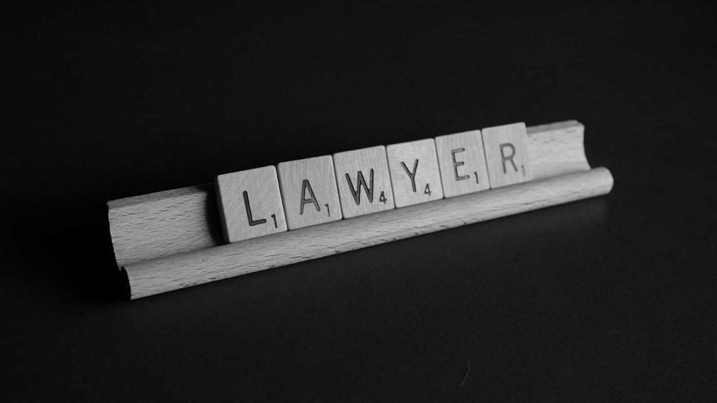 Scrabble tiles spelling the word ‘lawyer’