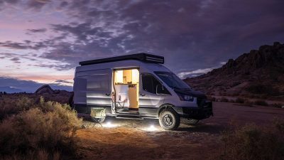 Converted campervan parked at dusk