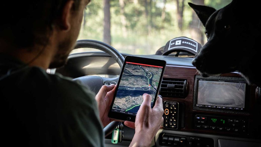 Man using a GPS tracking app in his car