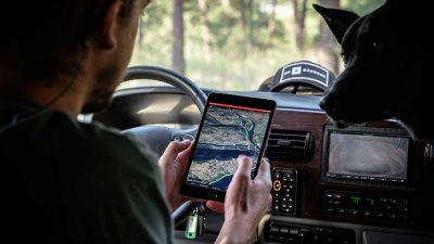 Man using a GPS tracking app in his car