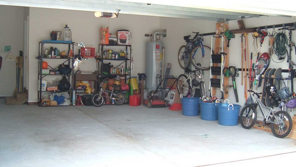 Refurbished garage with bikes, skateboards and other outdoor equipment nicely organised