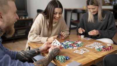 Friends having fun while playing poker in Canada