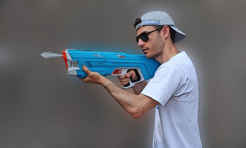 Firing a blast of water from the SpyraThree electric water gun