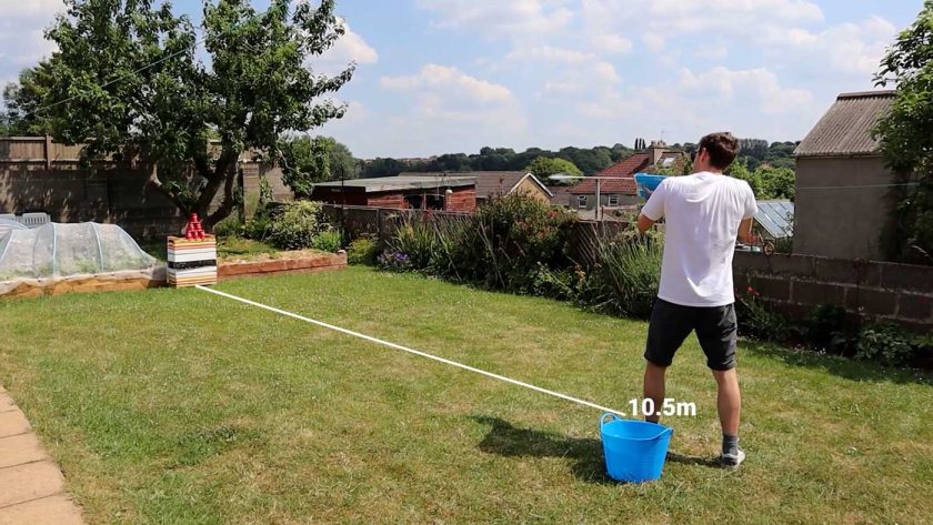 Knocking over cup targets with the SpyraThree electric water blaster at a range of 10.5m