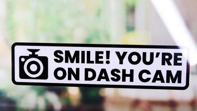 Car sticker reading ‘Smile! You’re on dash cam’