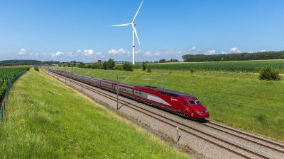 A red Eurostar train travelling from Paris-Nord to Amsterdam Central, pictured near Wez-Velvain, Belgium.